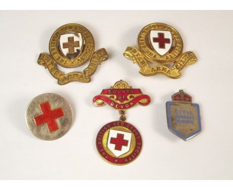 ENAMEL BADGES.
Enamelled British Red Cross badges, a Civil Nursing pin etc.