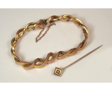 GOLD BRACELET ETC.
A 9ct. rose gold, flexible bracelet & a Victorian 15ct. gold stick pin.