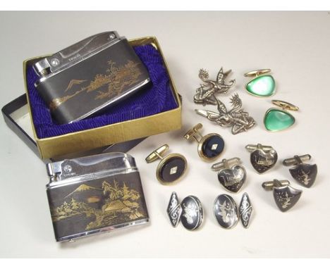 CIGARETTE LIGHTERS ETC.
A damascened musical cigarette lighter in original box, one other cigarette lighter & four pairs of c
