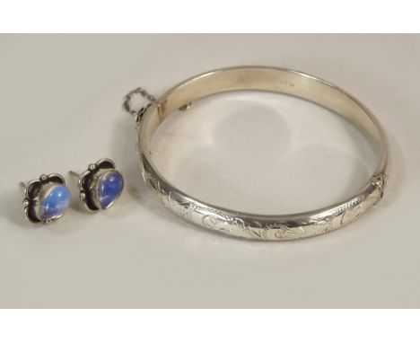 SILVER JEWELLERY.
A engraved silver bangle & a pair of moonstone set earrings.