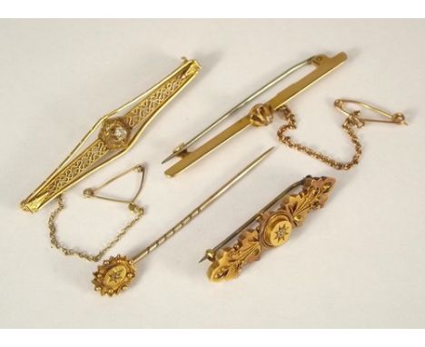 STICK PIN ETC.
A Victorian 15ct. gold stick pin, a 15ct. gold bar brooch, an 18ct. gold diamond set bar brooch & a 10k. bar b