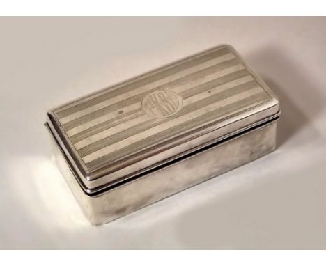 CHINESE BOX.
A Chinese engine turned silver box, by Wang Hing. 9 x 4.5cm. Stamped WH90 & with Chinese characters.