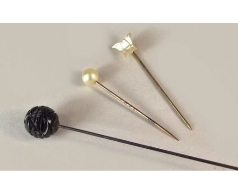 HAT PINS.
A Victorian carved jet hat pin & two stick pins.