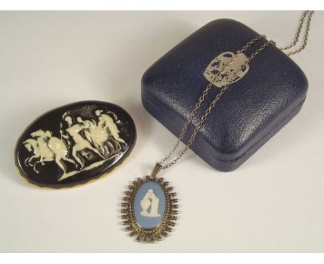 WEDGWOOD ETC. 
A silver mounted Wedgwood pendant & a ceramic pendant.