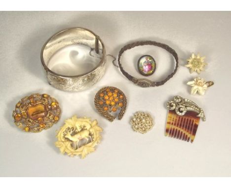 COSTUME JEWELLERY.
Including a silver cuff bangle, a woven hair bangle etc.