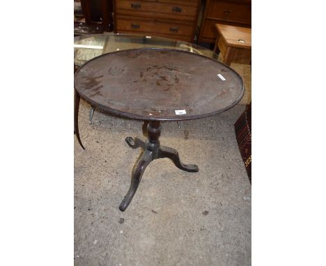 A 19th Century mahogany oval topped occasional table set on a turned column with tripod base