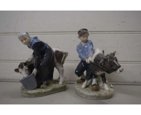 ROYAL COPENHAGEN WARES - PAIR OF FIGURES, MILKMAID WITH COW AND BOY WITH CALF