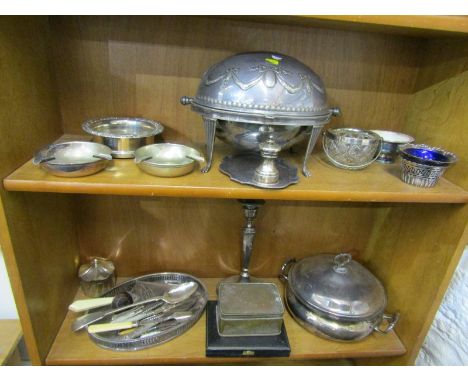 SILVERPLATE, tambour topped breakfast tureen, 2 coin inset ashtrays, silverplate serving spoon and contents of 2 shelves 