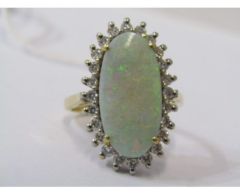 18CT YELLOW GOLD OPAL &amp; DIAMOND CLUSTER RING, principle large oval cabachon opal surrounded by brilliant cut diamonds in 