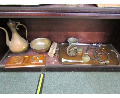 EXTENDING HORSE SHOE DESIGN BOOK RACK, Eastern copper flagon, copper twin handled tray and contents of shelf 