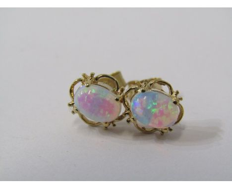 PAIR OF 9CT YELLOW GOLD OPAL EARRINGS, oval cabachon cut set in 9ct yellow gold floral style mounts 