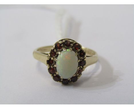 9CT YELLOW GOLD OPAL &amp; GARNET CLUSTER RING, principle oval cut cabachon opal surrounded by brilliant cut garnet in 9ct ye