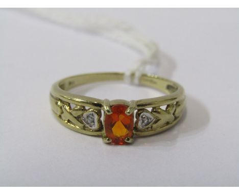 9CT YELLOW GOLD FIRE OPAL &amp; DIAMOND RING, principle oval cut fire opal set with small accent diamond in heart shaped cart