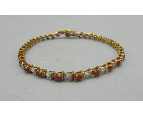 9ct yellow gold tennis bracelet set with rubies and diamonds, stamped 375, L19cm, 7.13gShipping £23.00 plus vat (UK Only)