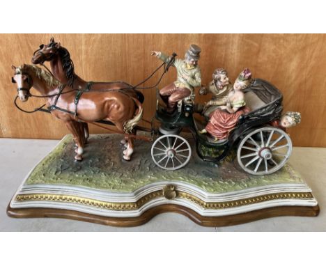 Large Capodimonte porcelain model, 'The Carriage', signed 'B. Merli', modelled as a male and female couple seated in a carria