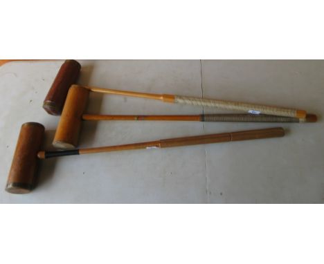Two F. H. Ayres London croquet mallets and one other croquet mallet, 96cm max (3)Shipping POA https://www.bradleys.ltd/quotat