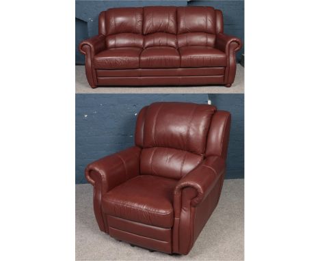 A brown leather 3 seat sofa with folding drinks holder along with matching reclining armchair.  