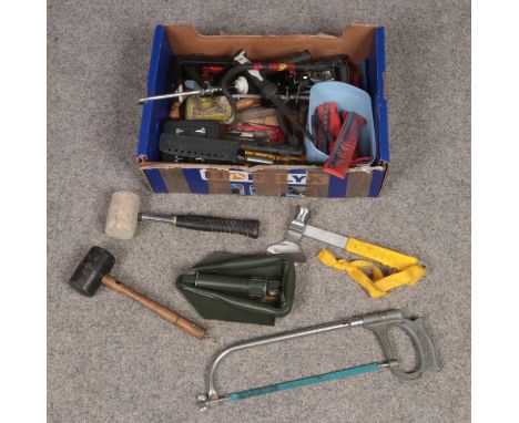 A box of tools. Includes mallets, folding shovel, saw etc.  