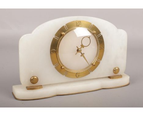 An alabaster mantel clock. With brass chapter ring and Arabic numeral markers.  Not running.
