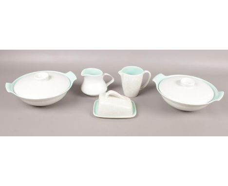 Five pieces of Poole Pottery. To include two lidded tureens, cheese dish, and two jugs.  Condition very good. No chips or cra