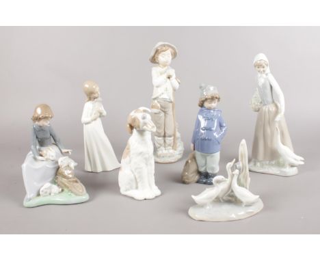 Seven Nao figures. Dog, girl sitting with rabbits, boy with duffle coat &amp; bag examples etc. (29cm tallest)  