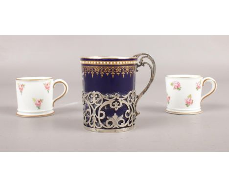 A group of ceramics. Two Royal Crown Derby 'Roses' miniature mugs &amp; a Royal Worcester silver mounted coffee can, assayed 