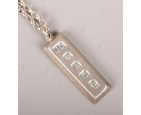 A silver ingot and chain. Assayed Sheffield 1977 by JD. 43.7g  