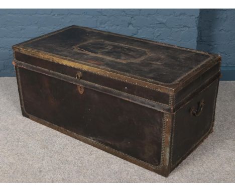 A large 19th century leather bound camphor wood twin handled trunk with stud decoration (Height 47cm Width 105cm  Depth 54cm)