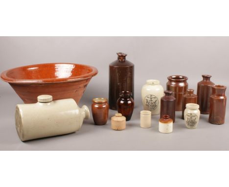 A collection of Stoneware. Vintage hot water bottle, Panchon, advertising bottles examples etc.  
