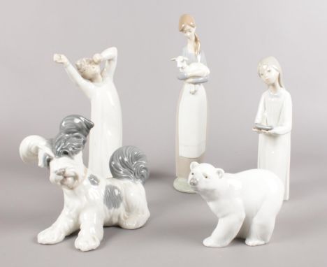 Five Lladro figures. Polar Bear, dog, girl walking with candlestick examples etc. (28cm tallest)  