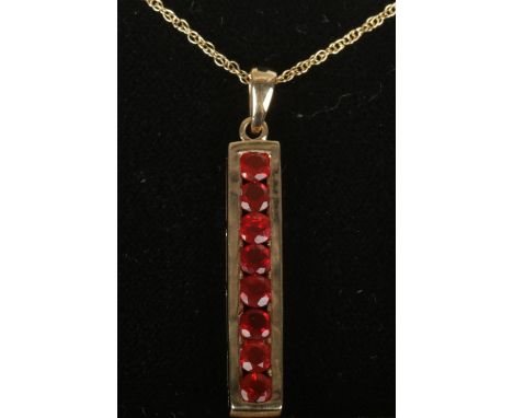 A 9ct gold 8 stone fire opal pendant on chain. 3.64g.  