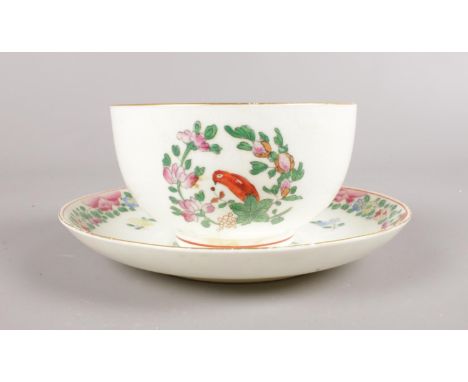 A Royal Worcester hand-painted small bowl and saucer. Decorated in the Worcester parrot pattern with gilt edging. Saucer : D1