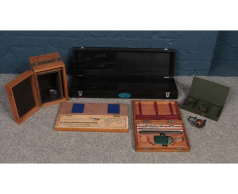 A box of assorted engineering tools and wooden boxes. To include measuring tools, a Temperature gauge and a small metal box w