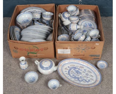 Two boxes of oriental blue &amp; white ceramic tea/dinnerwares. Including dinnerplates, meat plates, tureen, cups &amp; sauce