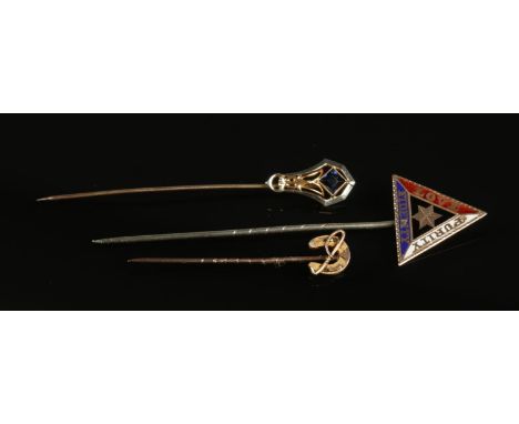 Three stick pins. Includes 10ct gold example with blue stone, 9ct gold equestrian example and one other.  