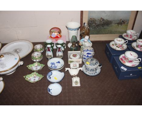 A collection of Oriental and other ceramics including blue and white bowls, a blue and white pot and cover, a figure of a fis