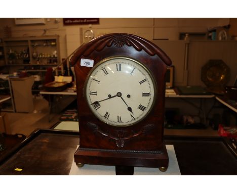 An early 19th Century mahogany bracket clock, the domed case with applied leaf decoration, 8 day movement striking on a bell,