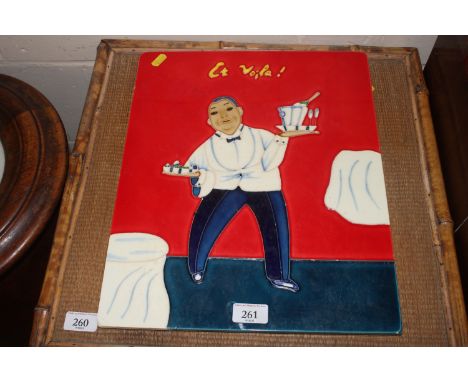 A tile picture in the form of a waiter 