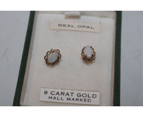 A pair of 9ct gold and opal set ear-rings, approx. total weight 1gm