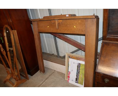 An Art Deco oak fire surround 