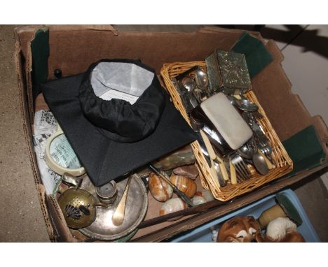 A box containing various silver plated cutlery, onyx eggs, a silver plated chamber stick etc. 