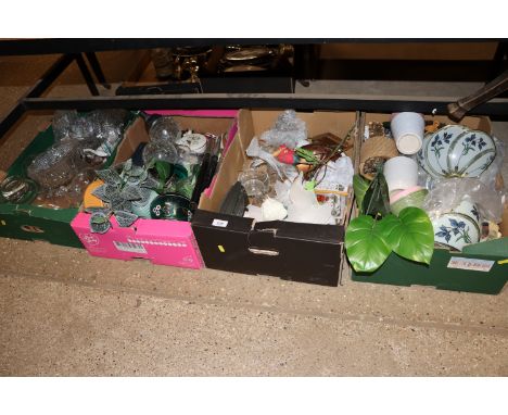 Four boxes of various sundries including glassware, light shades etc. 