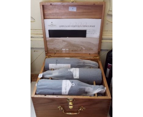 Six bottles of Quinta do Vesuvio vintage port, 1999, in a presentation wooden box
Specialist delivery of wine can be arranged