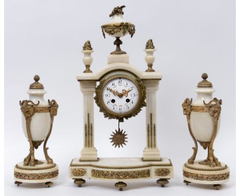 A clock garniture, the clock having a 9 cm diameter enamel dial with Arabic numerals, fitted an eight day movement, in a marb