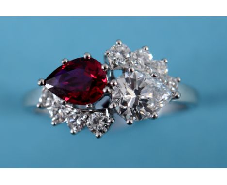 A platinum, ruby and diamond ring, approx. ring size L½  See inside front cover colour illustration Condition report Report b