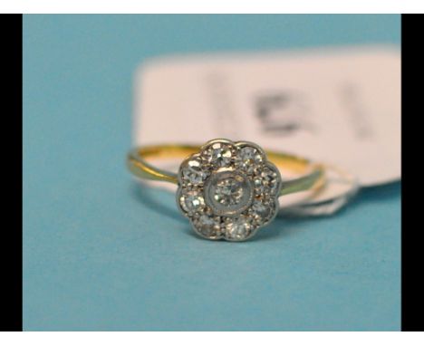 An 18ct gold, platinum and diamond flowerhead ring, approx. ring size M