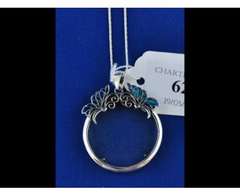 A silver and enamel butterfly spy glass necklace