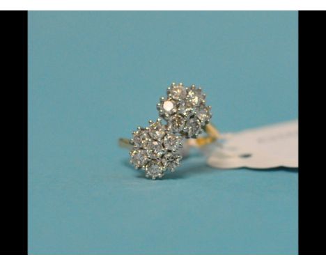 An 18ct yellow gold and diamond double flowerhead ring, approx. ring size M½