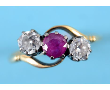 An 18ct gold, platinum ruby and diamond crossover ring, approx. ring size K  See inside back cover colour illustration