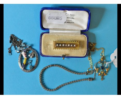 A 9ct gold pendant, a silver and enamel brooch, a silver and paste bracelet, and a diamond and seed pearl bar brooch